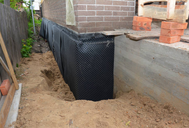 Happy homeowners after waterproofing job in Napoleon